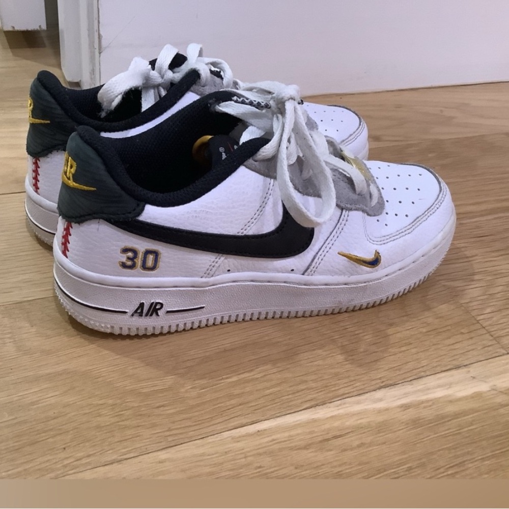 Nike Kids White and Black Sneakers with Gold Accents